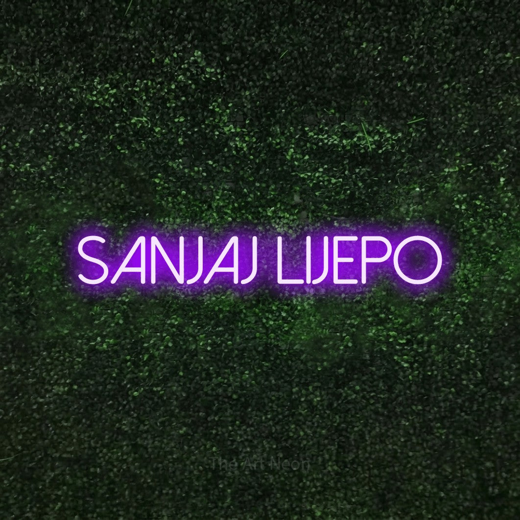 LED neon sign reading “Sanjaj Lijepo”, arranged in a single line.