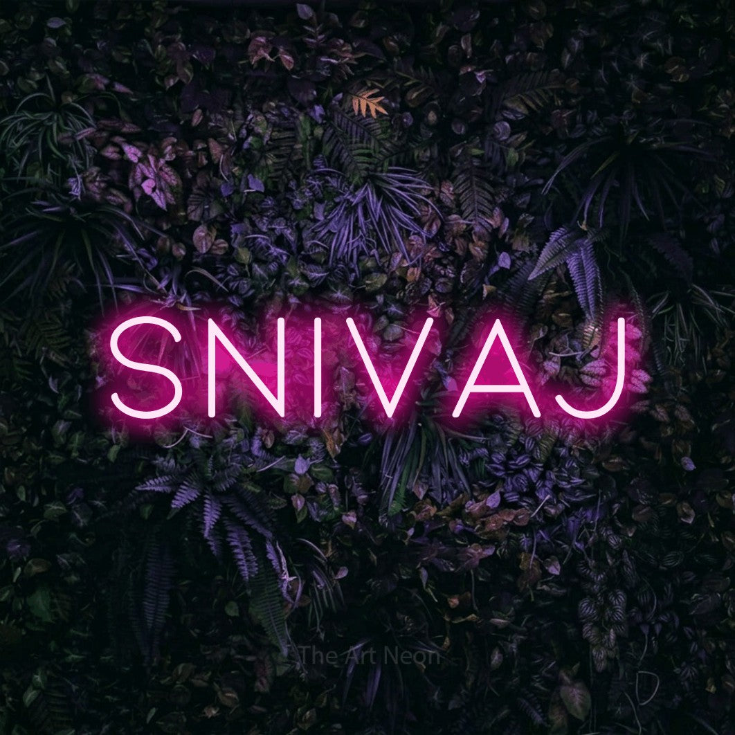 LED neon sign reading “snivaj”, arranged in a single line.