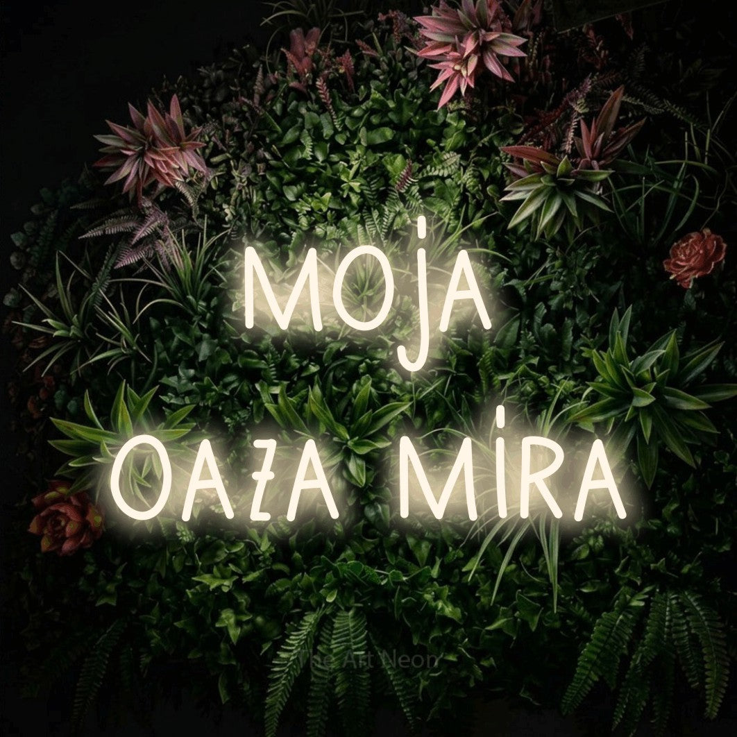 LED neon sign reading “moja oaza mira”, arranged in two lines.