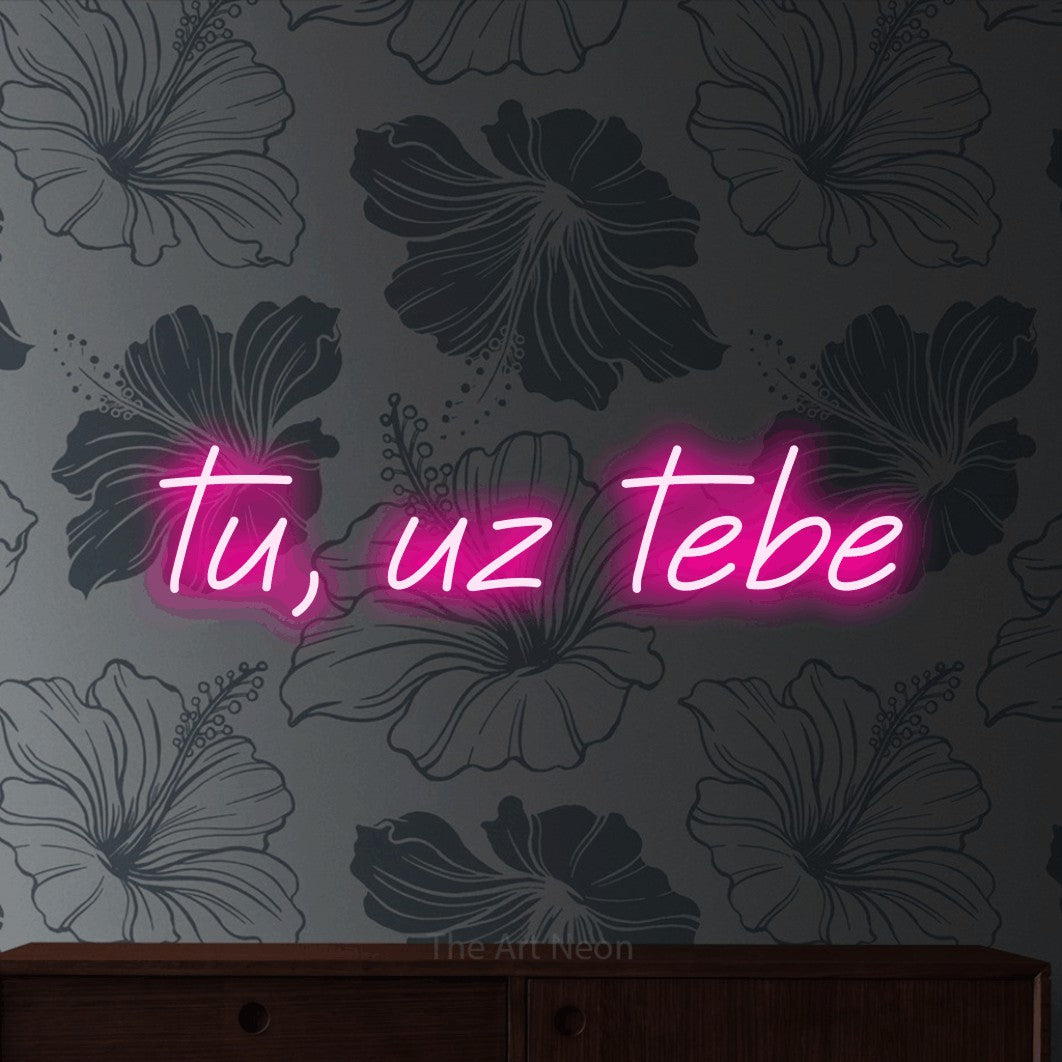 LED neon sign reading “tu, uz tebe”, arranged in a single line.