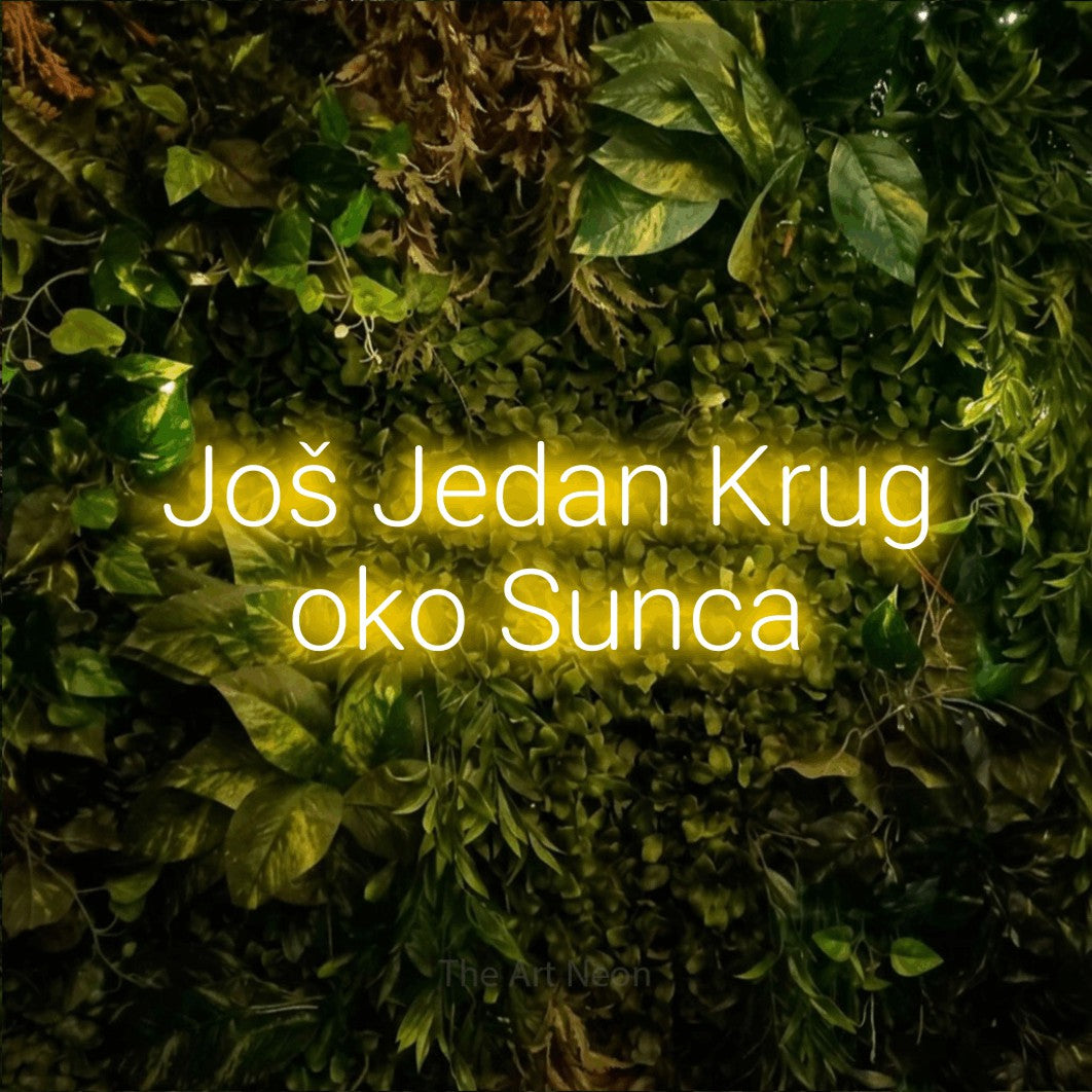 LED neon sign reading “Još Jedan Krug oko Sunca”, arranged in two lines.