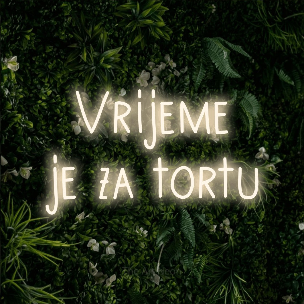 LED neon sign reading “Vrijeme je za tortu”, arranged in two lines.