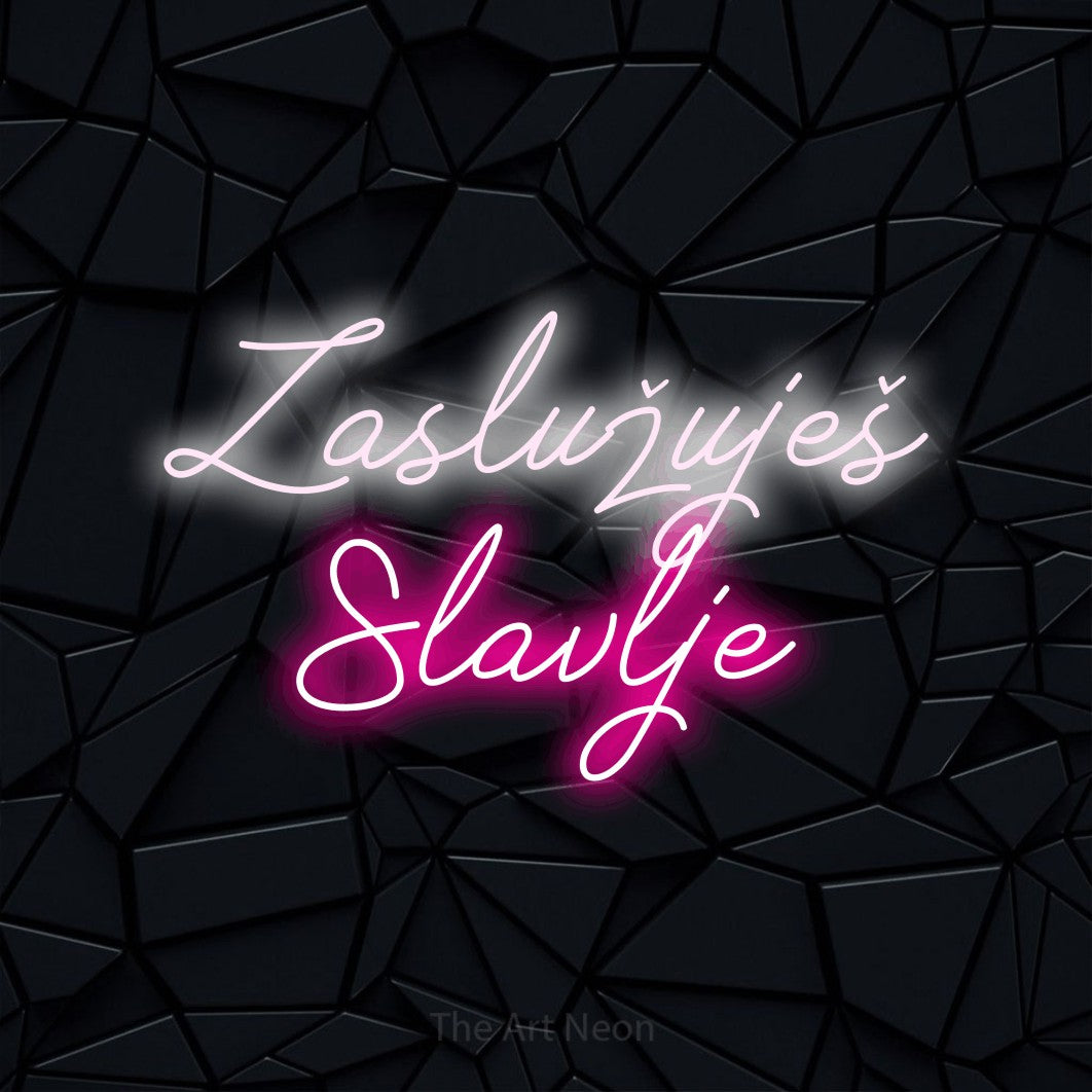 LED neon sign reading “Zaslužuješ Slavlje”, arranged in two lines.