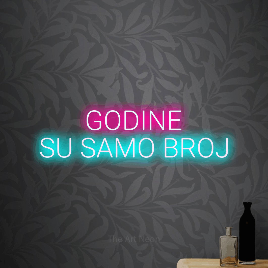 LED neon sign reading “GODINE SU SAMO BROJ”, arranged in two lines.