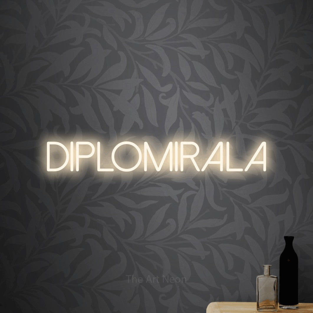 LED neon sign reading “Diplomirala”, arranged in a single line.