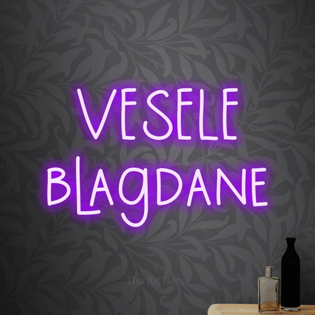 LED neon sign reading “VESELE blagdane”, arranged in two lines.