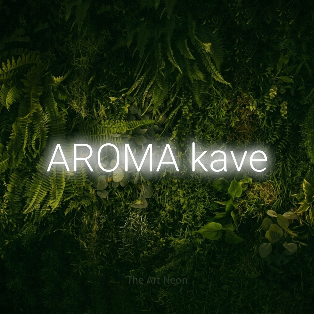 LED neon sign reading “AROMA kave”, arranged in a single line.