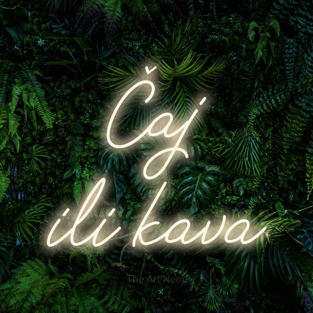 LED neon sign reading “Čaj ili kava”, arranged in two lines.