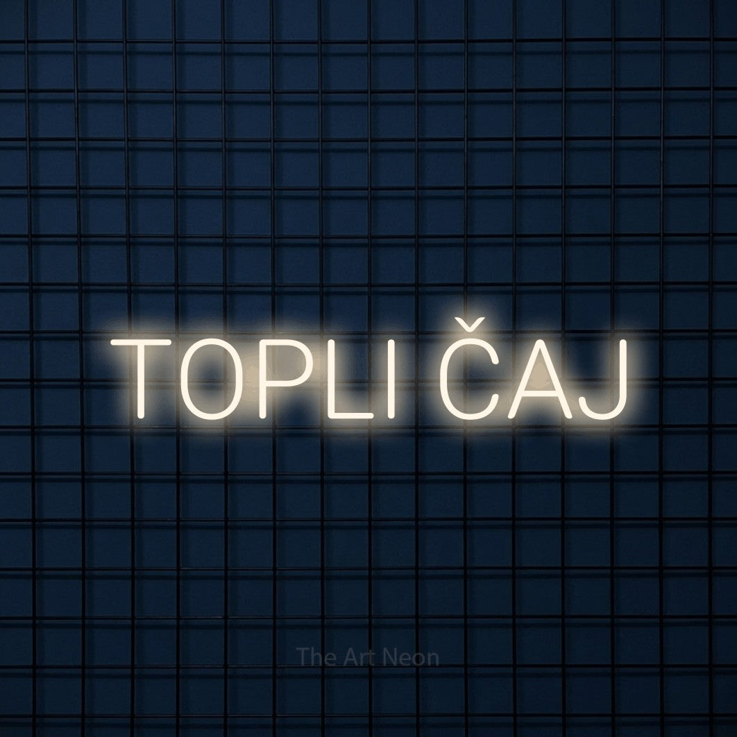 LED neon sign reading “TOPLI ČAJ”, arranged in a single line.