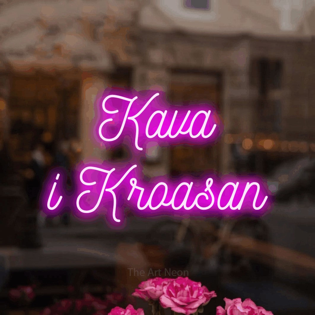 LED neon sign reading “Kava i Kroasan”, arranged in two lines.
