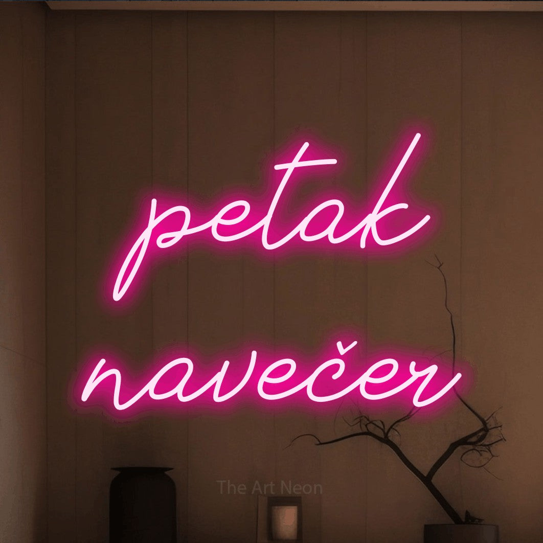 LED neon sign reading “petak navečer”, arranged in two lines.