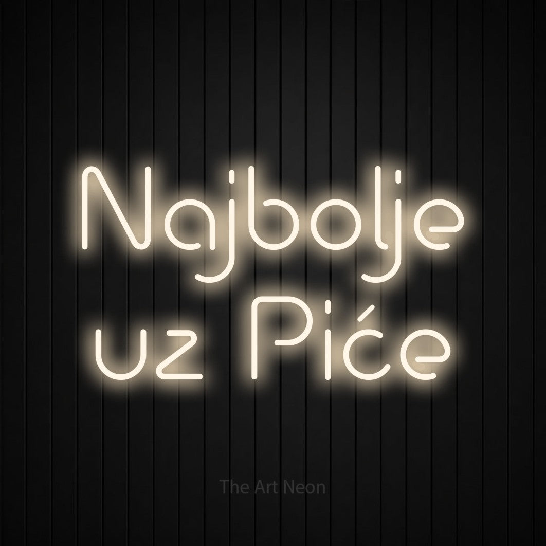 LED neon sign reading “Najbolje uz Piće”, arranged in two lines.
