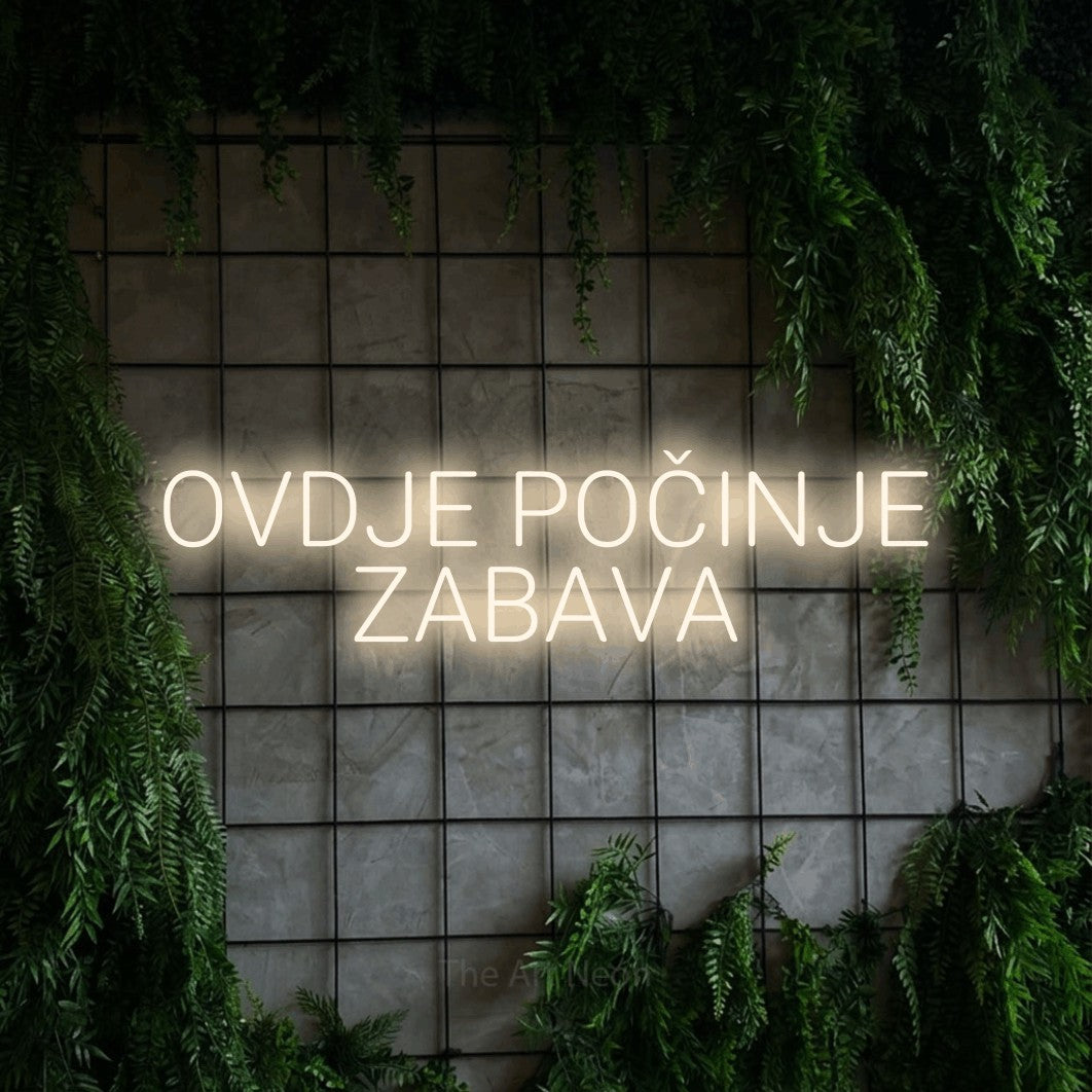 LED neon sign reading “OVDJE POČINJE ZABAVA”, arranged in two lines.