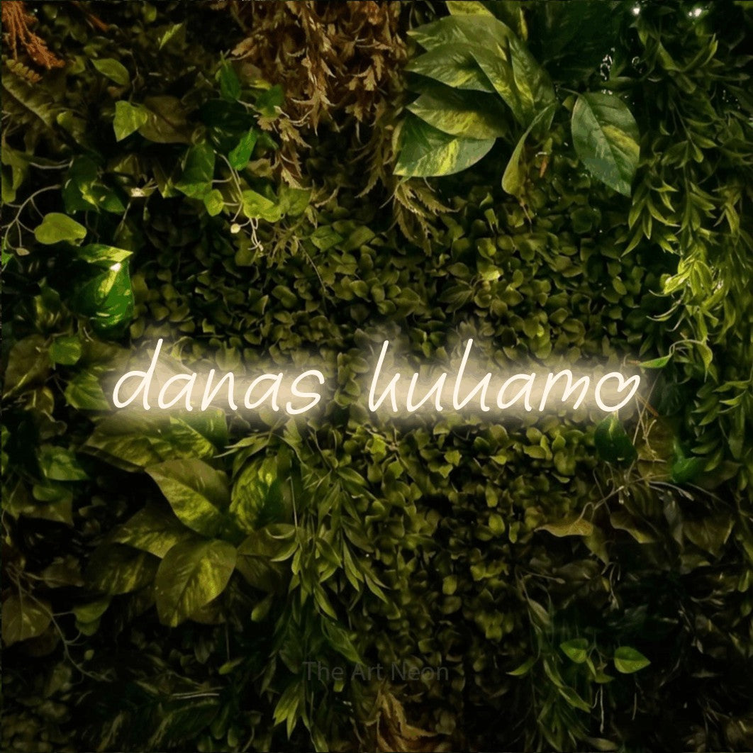 LED neon sign reading “danas kuhamo”, arranged in a single line.