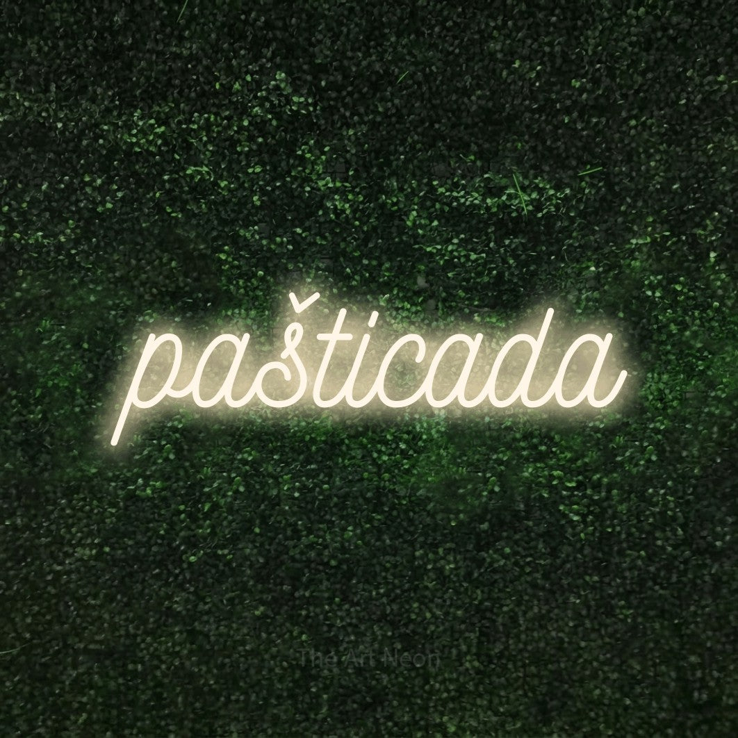 LED neon sign reading “pašticada”, arranged in a single line.