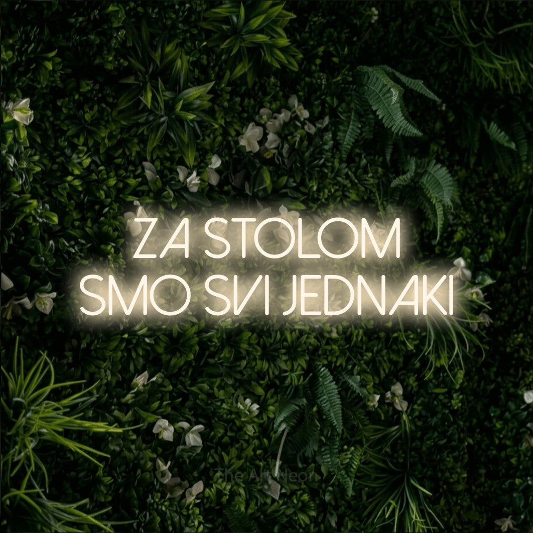LED neon sign reading “ZA STOLOM SMO SVI JEDNAKI”, arranged in two lines.