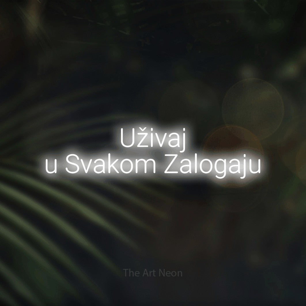 LED neon sign reading “Uživaj u Svakom Zalogaju”, arranged in two lines.