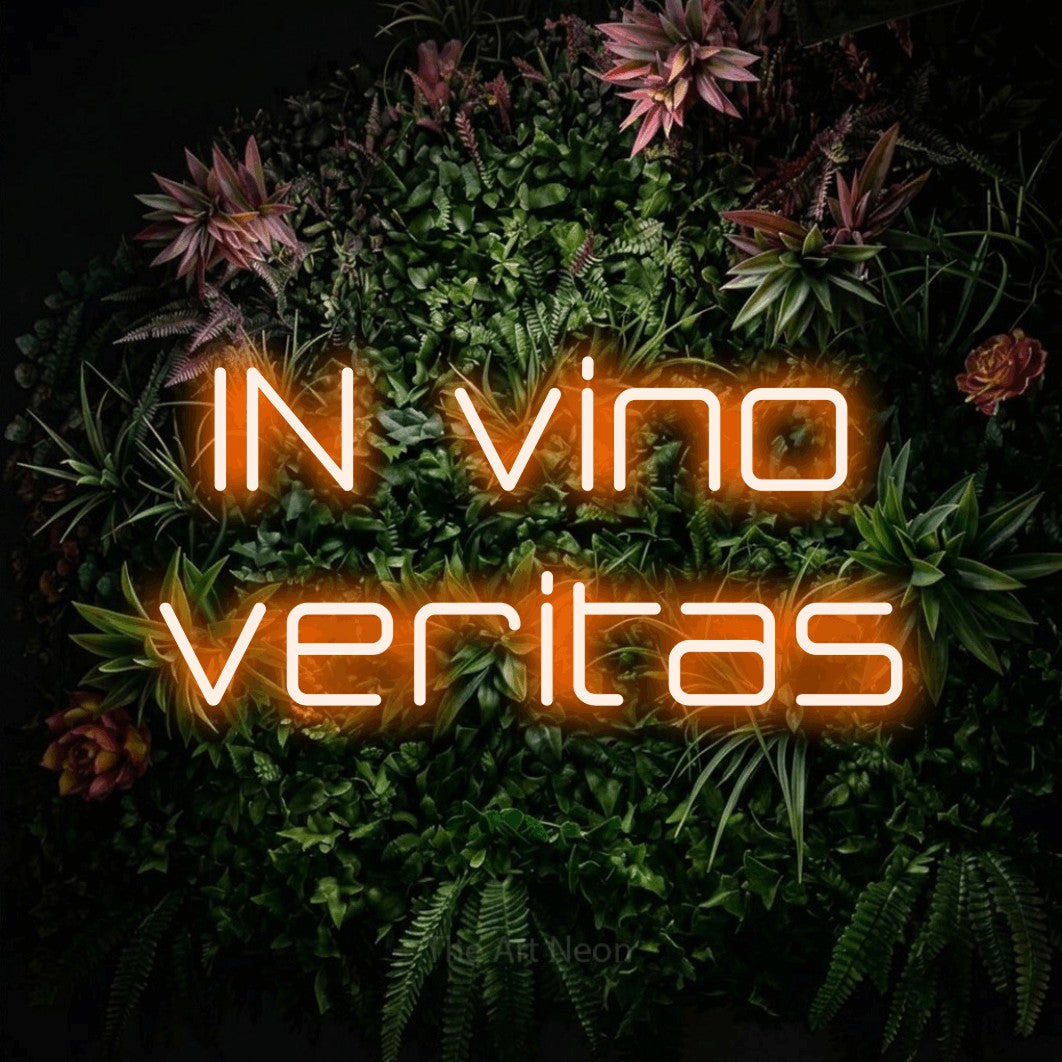 LED neon sign reading “IN vino veritas”, arranged in two lines.