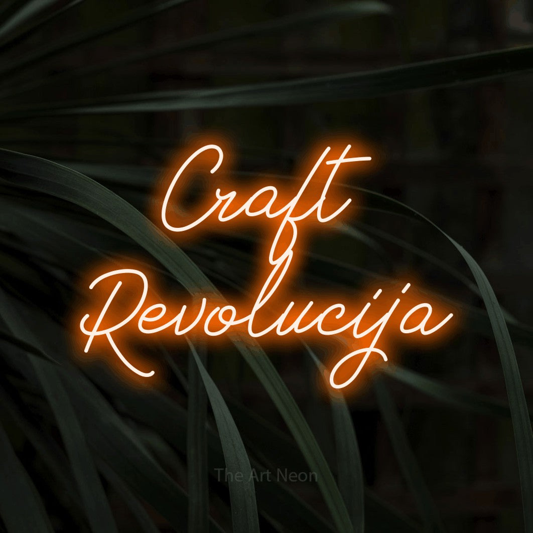 LED neon sign reading “Craft Revolucija”, arranged in two lines.