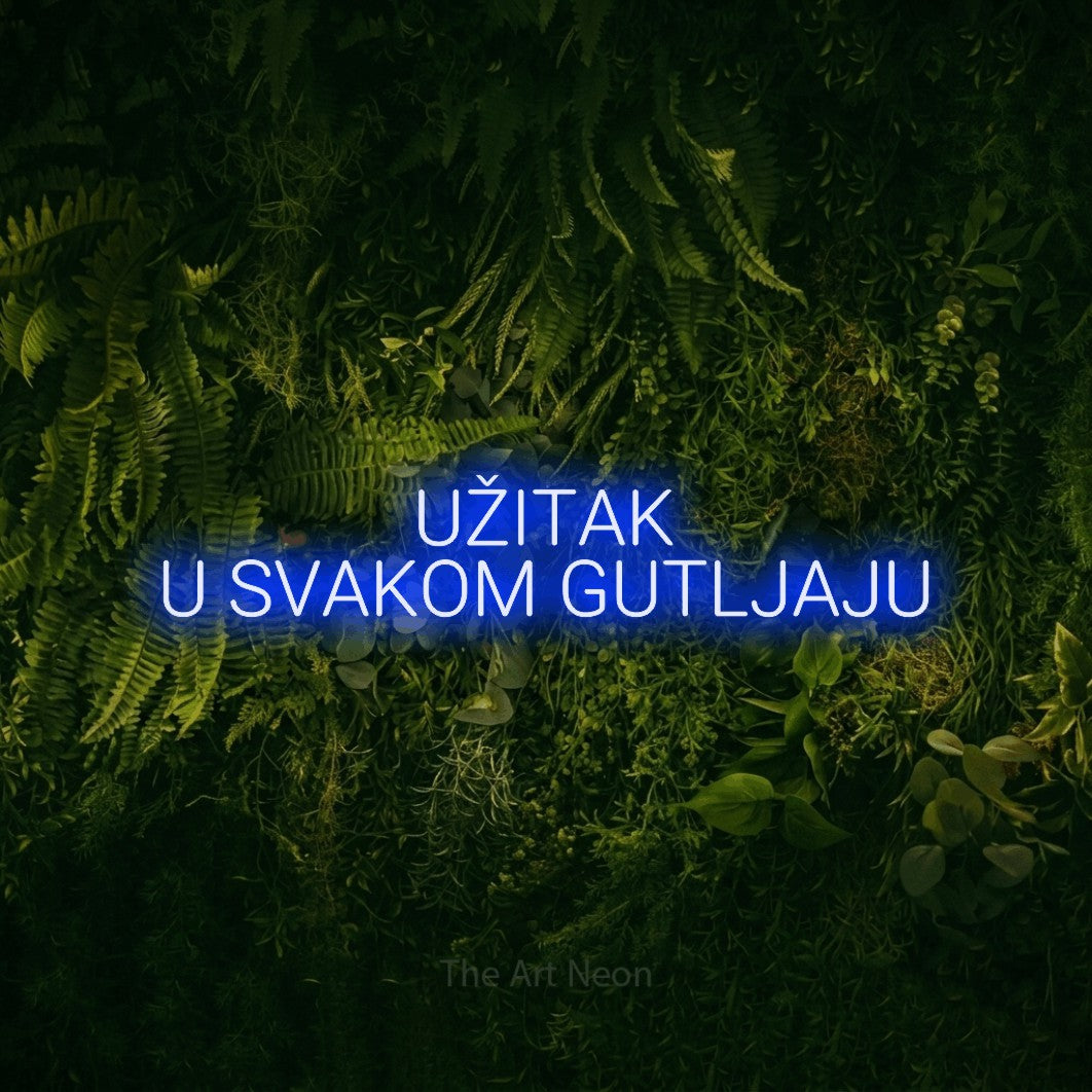 LED neon sign reading “UŽITAK U SVAKOM GUTLJAJU”, arranged in two lines.