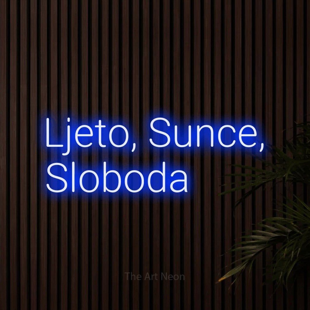 LED neon sign reading “Ljeto, Sunce, Sloboda”, arranged in two lines.