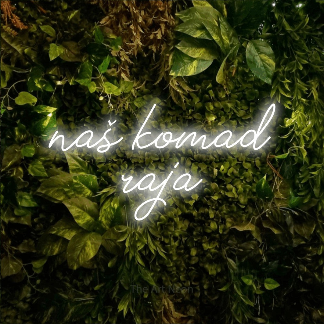 LED neon sign reading “naš komad raja”, arranged in two lines.