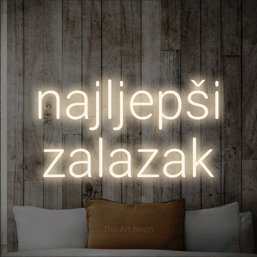 LED neon sign reading “najljepši zalazak”, arranged in two lines.