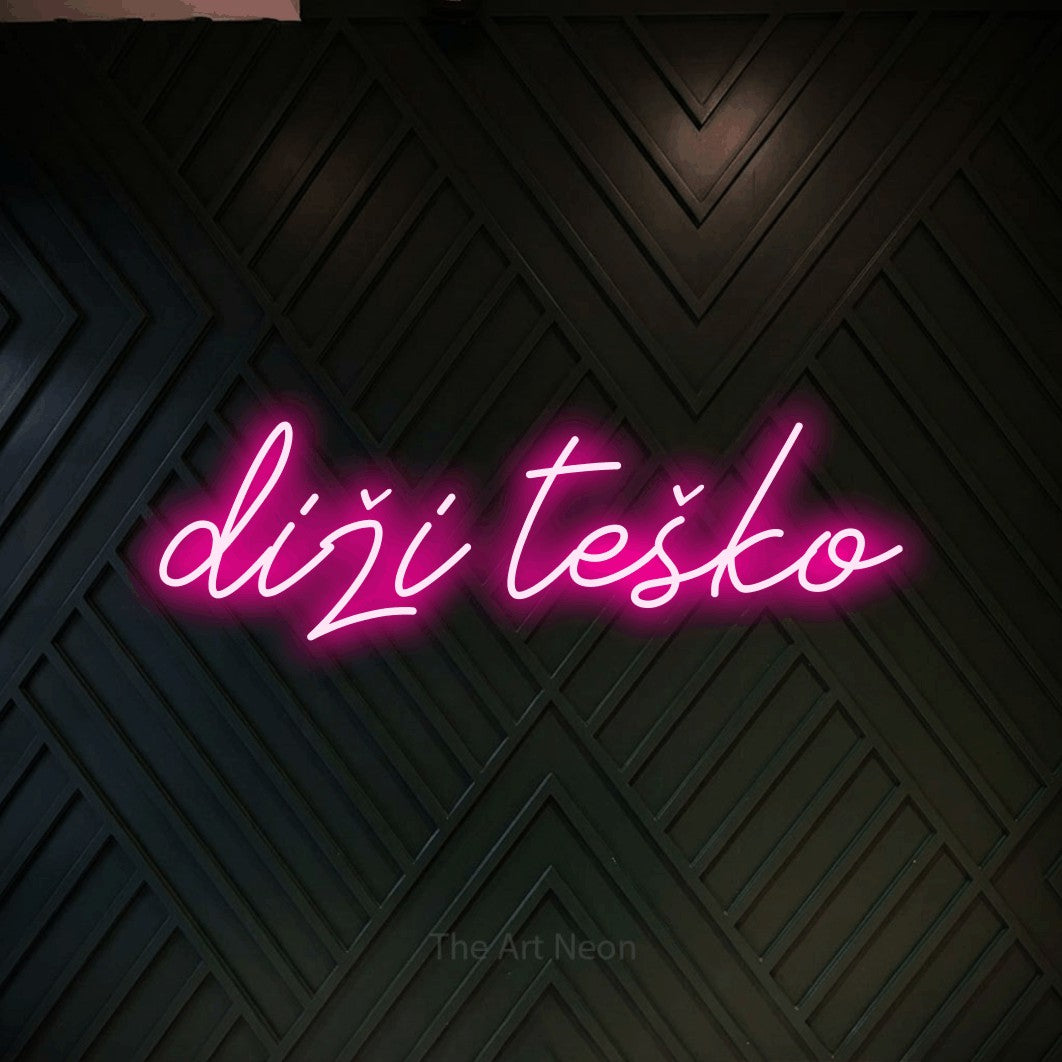 LED neon sign reading “diži teško”, arranged in a single line.
