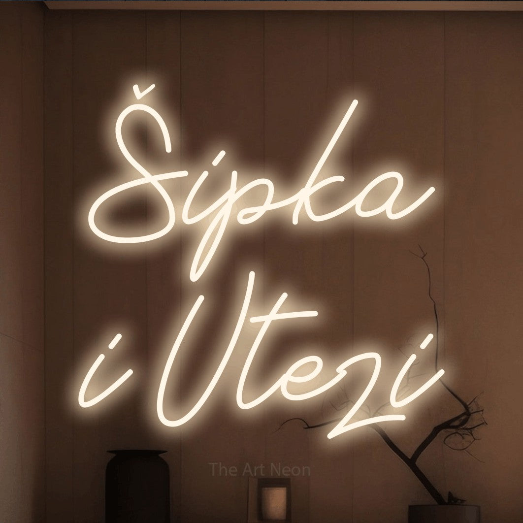 LED neon sign reading “Šipka i Utezi”, arranged in two lines.