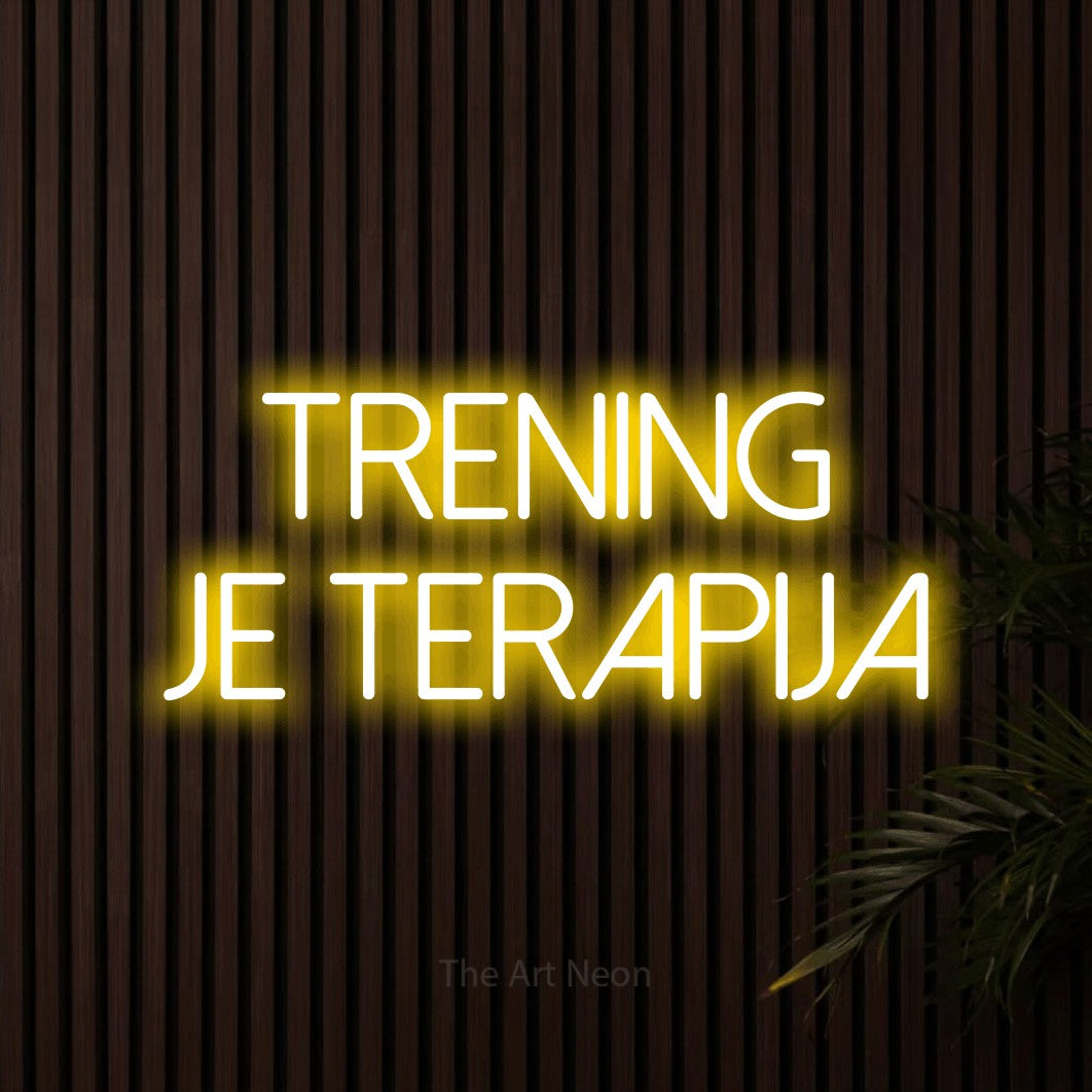 LED neon sign reading “Trening je Terapija”, arranged in two lines.