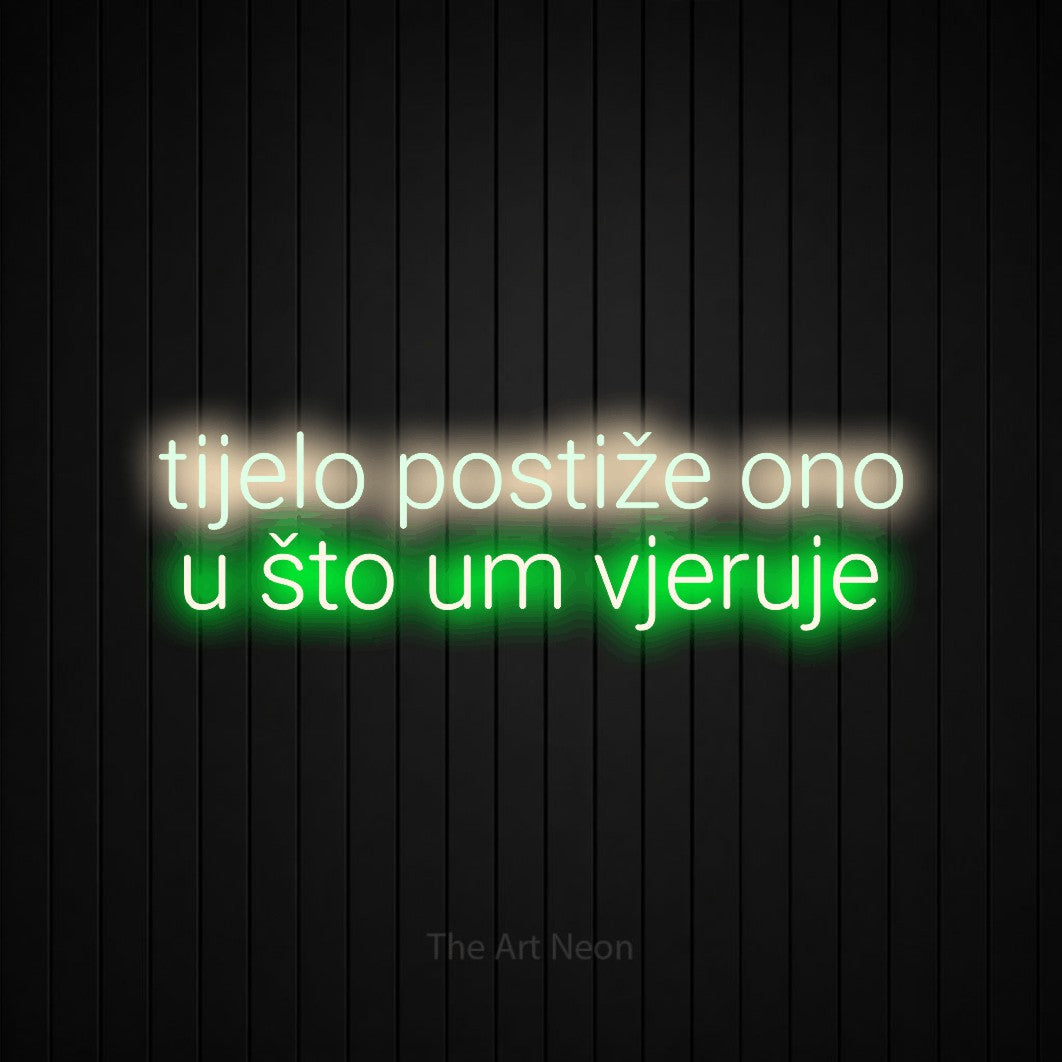 LED neon sign reading “tijelo postiže ono u što um vjeruje”, arranged in two lines.