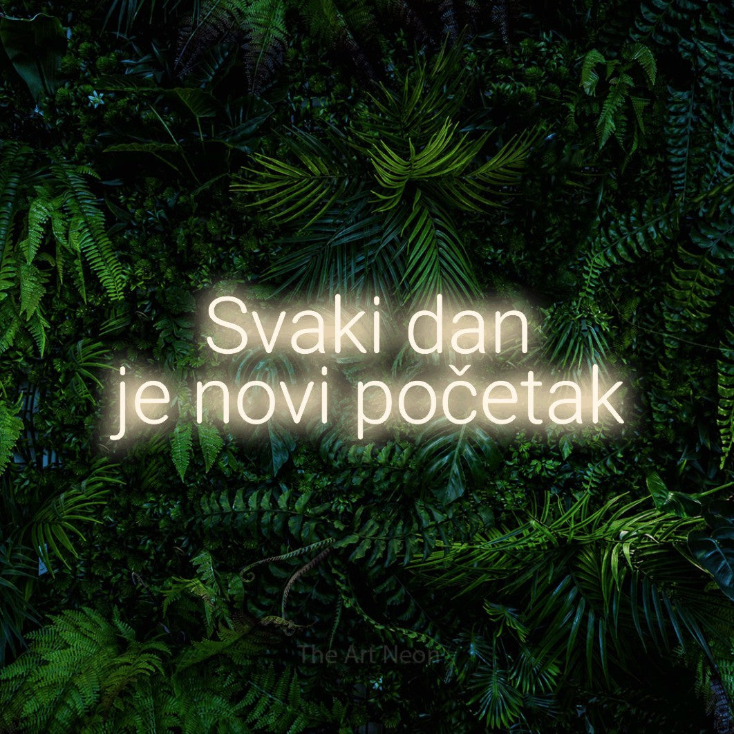 LED neon sign reading “Svaki dan je novi početak”, arranged in two lines.