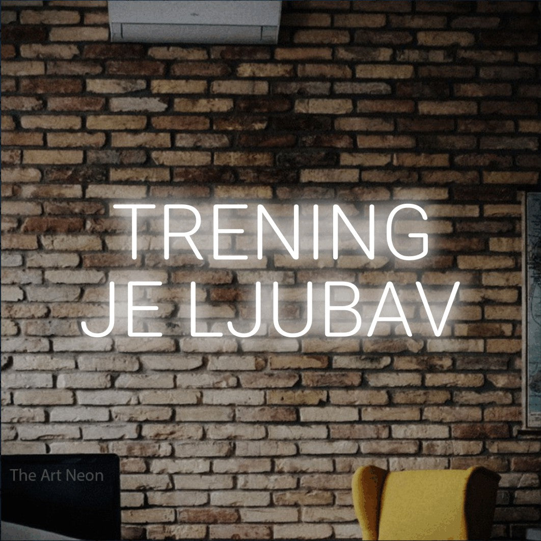 LED neon sign reading “TRENING JE LJUBAV”, arranged in two lines.