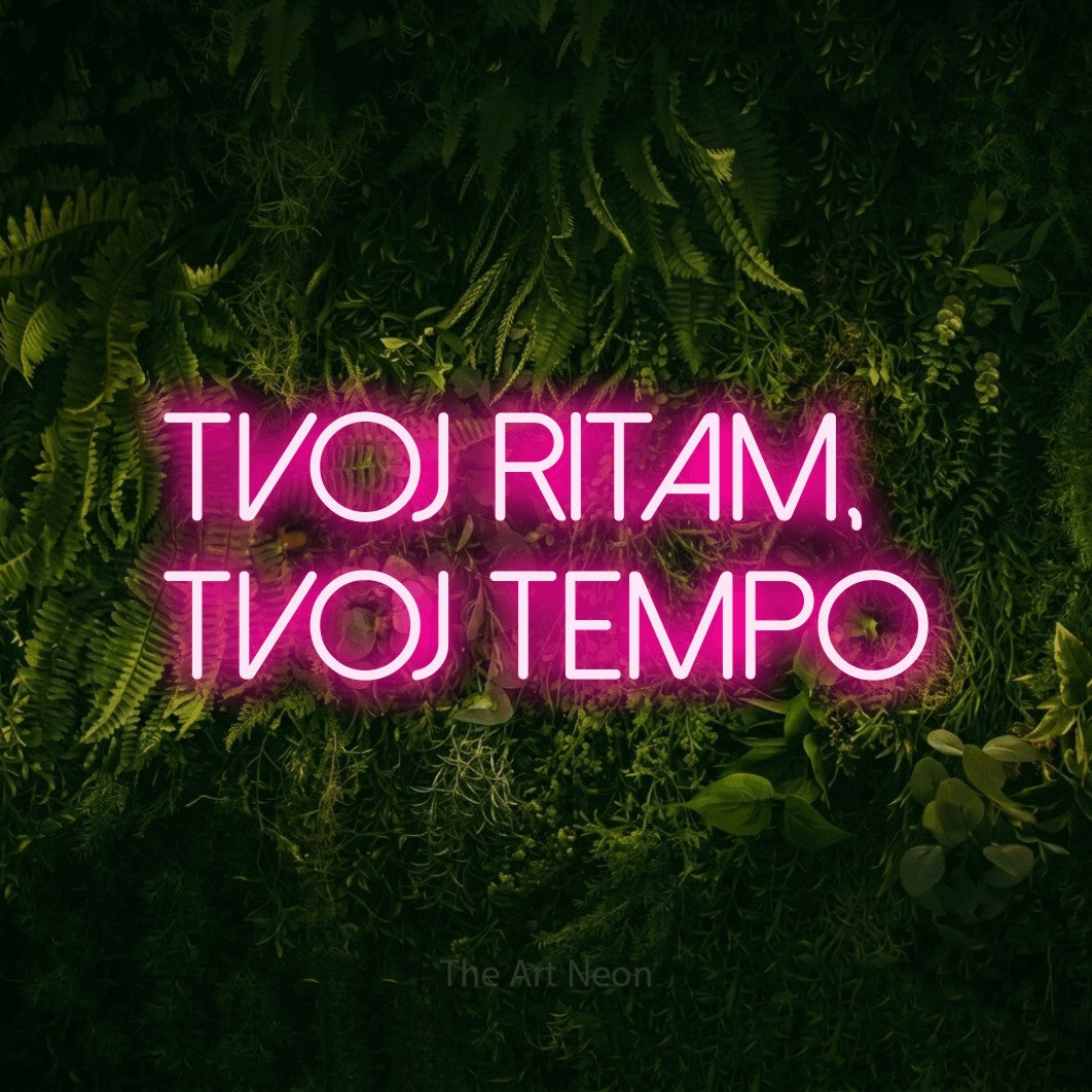 LED neon sign reading “tvoj ritam, tvoj tempo”, arranged in two lines.