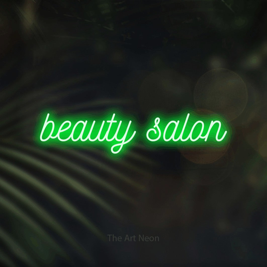LED neon sign reading “beauty salon”, arranged in a single line.