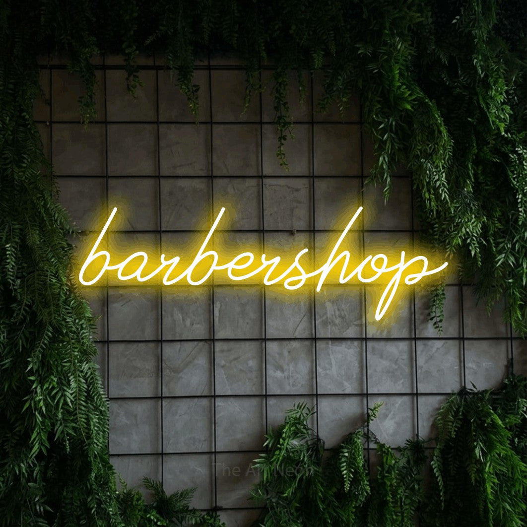 LED neon sign reading “barbershop”, arranged in a single line.