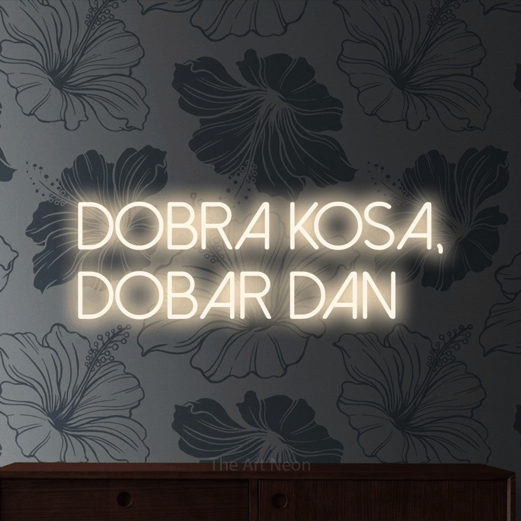 LED neon sign reading “Dobra Kosa, Dobar Dan”, arranged in two lines.
