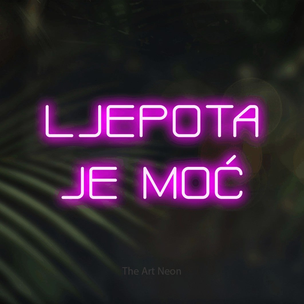 LED neon sign reading “LJEPOTA JE MOĆ”, arranged in two lines.
