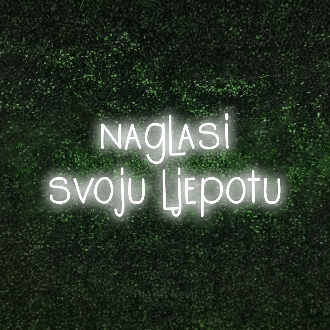 LED neon sign reading “naglasi svoju ljepotu”, arranged in two lines.