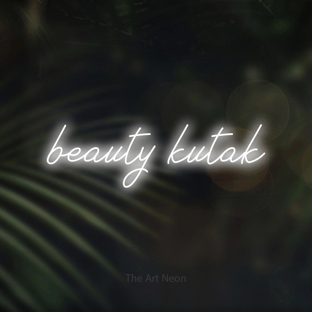 LED neon sign reading “beauty kutak”, arranged in a single line.