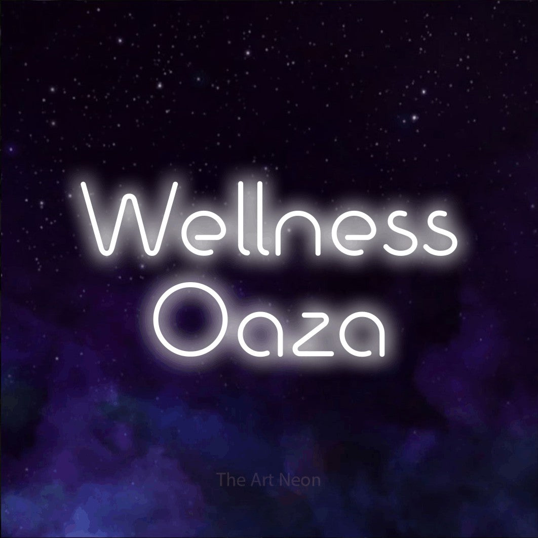 LED neon sign reading “Wellness Oaza”, arranged in two lines.