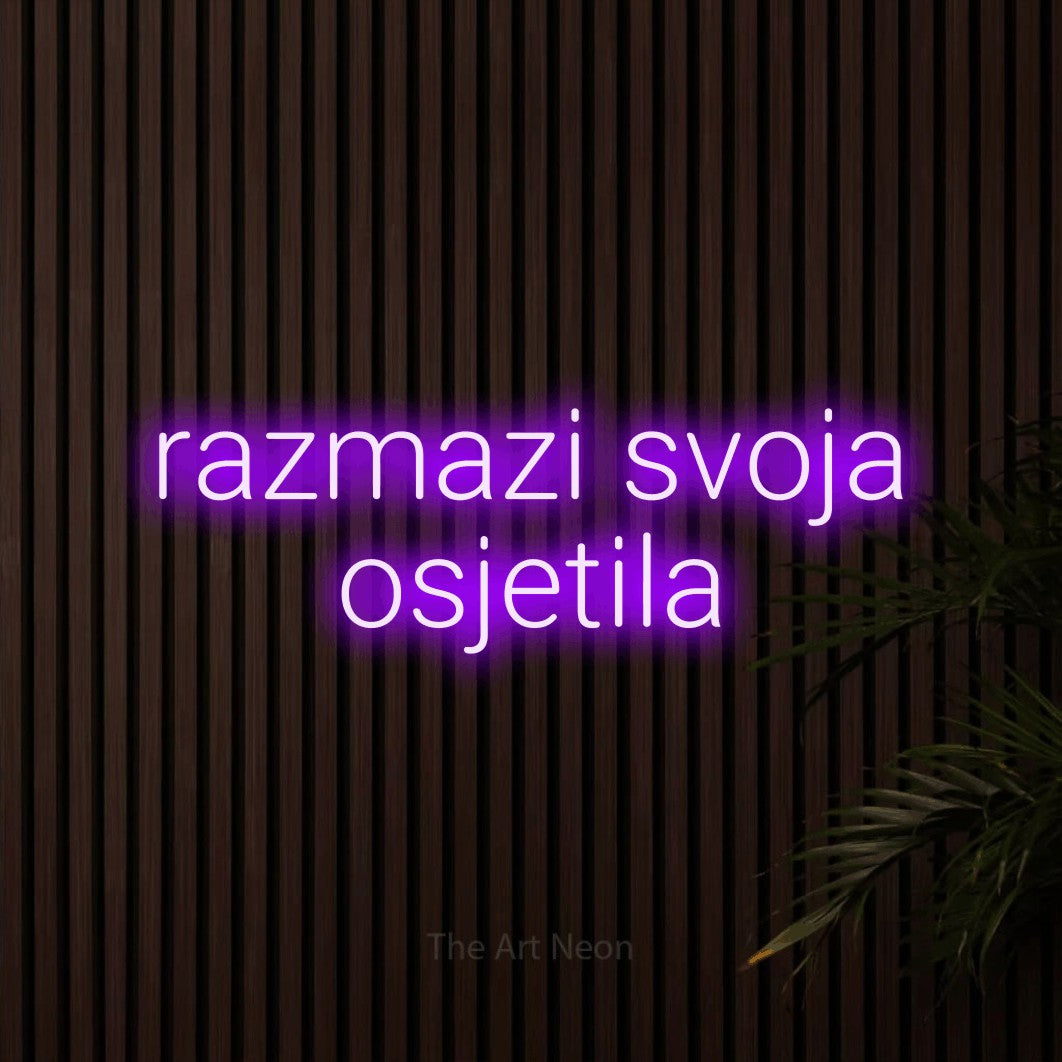 LED neon sign reading “razmazi svoja osjetila”, arranged in two lines.