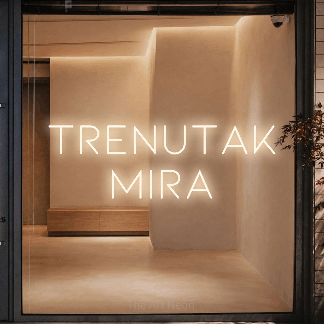 LED neon sign reading “TRENUTAK mira”, arranged in two lines.