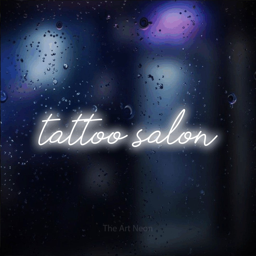 LED neon sign reading “tattoo salon”, arranged in a single line.