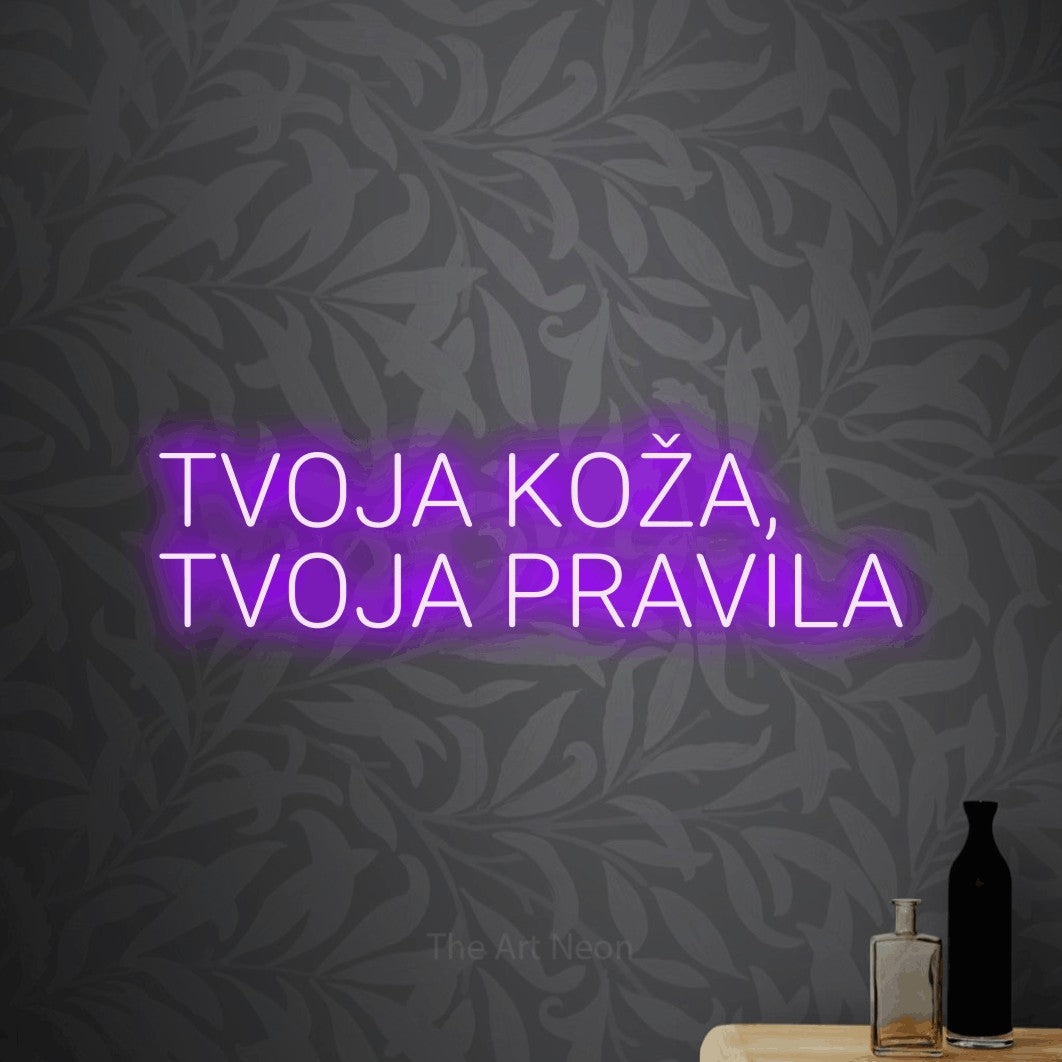 LED neon sign reading “TVOJA KOŽA, TVOJA PRAVILA”, arranged in two lines.
