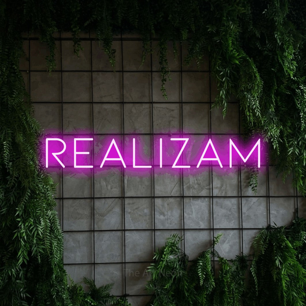LED neon sign reading “realizam”, arranged in a single line.