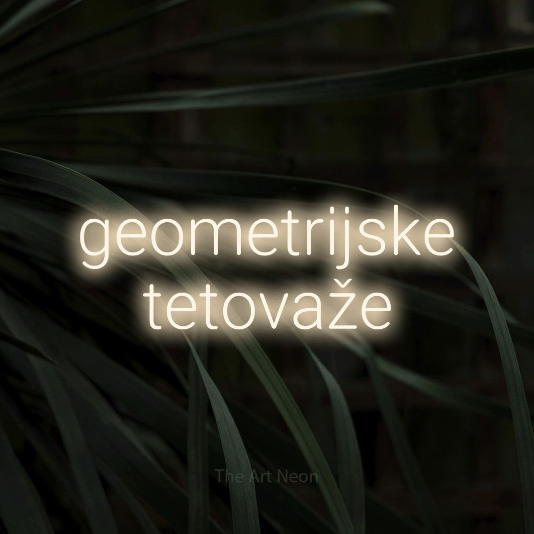 LED neon sign reading “geometrijske tetovaže”, arranged in two lines.