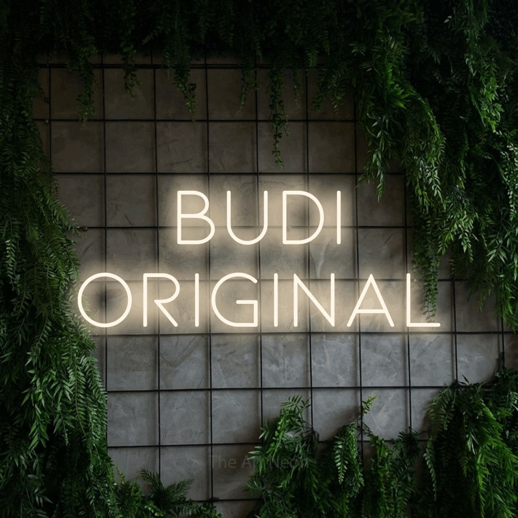 LED neon sign reading “Budi Original”, arranged in two lines.