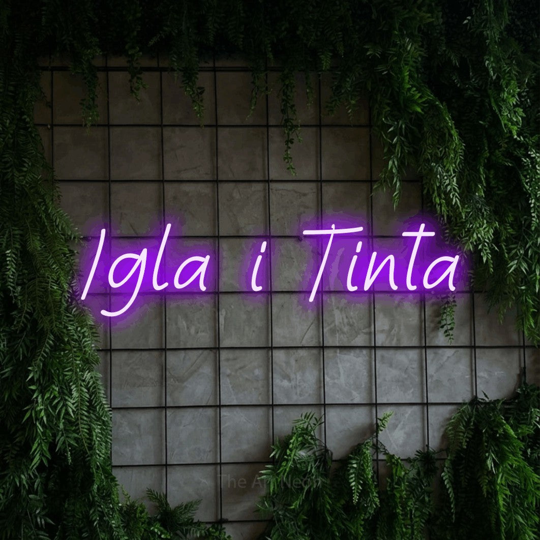 LED neon sign reading “Igla i Tinta”, arranged in a single line.
