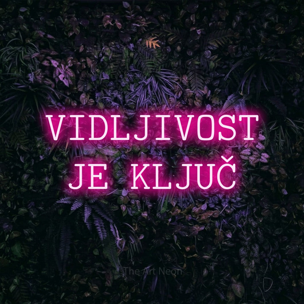 LED neon sign reading “VIDLJIVOST JE KLJUČ”, arranged in two lines.